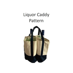 May include: A canvas liquor caddy with a black base and handles, holding two bottles. The caddy has a natural canvas color with black accents. The text "Liquor Caddy Pattern" is displayed above the caddy.
