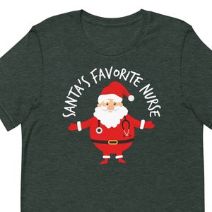 May include: A dark green t-shirt with the text "Santa's Favourite Nurse" in white lettering around a cartoon image of Santa Claus wearing a stethoscope.