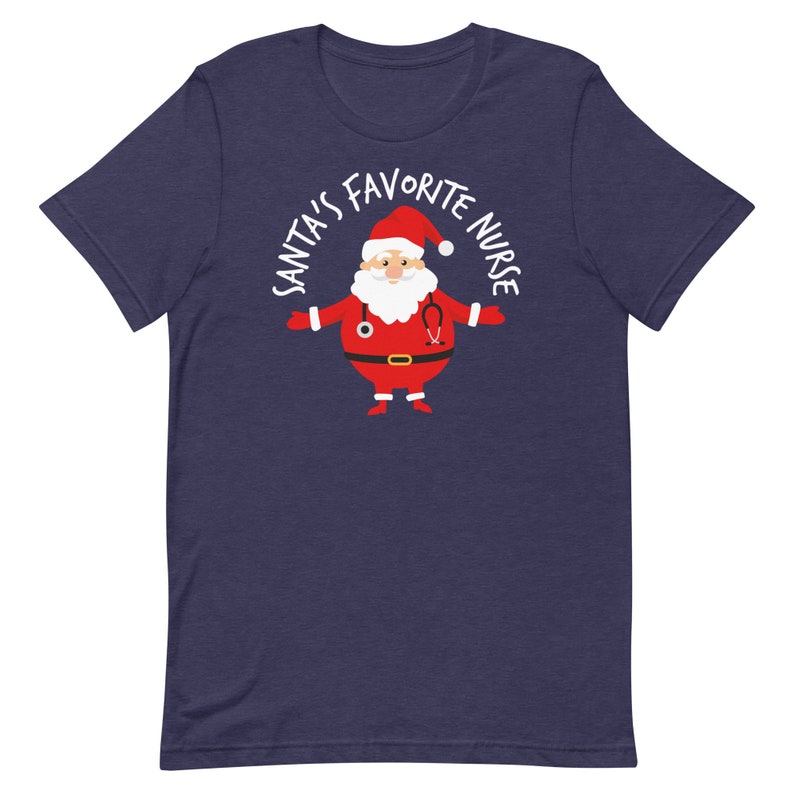May include: A navy blue t-shirt featuring a white graphic of Santa Claus wearing a stethoscope and the text "Santa's Favourite Nurse".