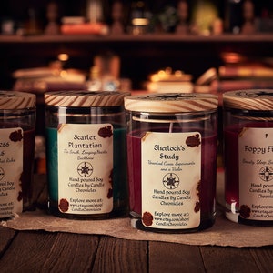 May include: Four glass jar candles with wooden lids, each labeled with a unique name: "Princess Buns," "Scarlet Plantation," "Sherlock's Study," and "Poppy Fields." The labels include descriptions and the Etsy shop name, CandleChronicles.