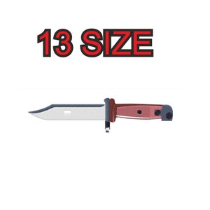 May include: A white and brown knife with a black handle. The knife is a 13 size.