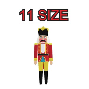 May include: A red and yellow nutcracker with a white beard and a blue and yellow hat. The nutcracker is standing on a white background. 11 SIZE