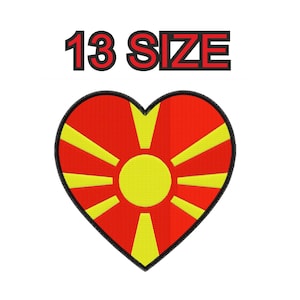 May include: A heart-shaped embroidered patch featuring the red and yellow sun design of the North Macedonian flag. The patch has a thick black border and is positioned below the text 13 SIZE, which is written in red letters with black outlines.