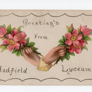 May include: A vintage postcard with a decorative border featuring two hands holding bouquets of pink flowers. The text "Greetings from Hadfield Lyceum" is printed on the postcard.