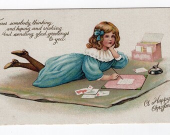 Antique Victorian Christmas card, little girl writing a letter, love letter, old fashioned greetings card, Christmas card list, pen and ink