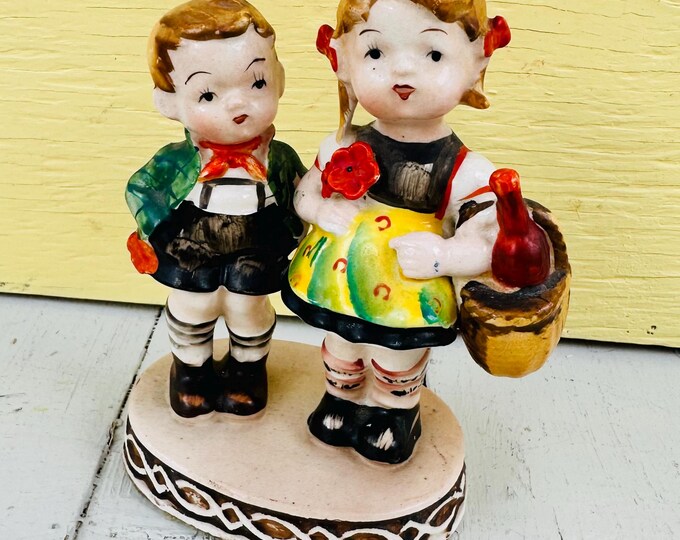 Vintage Occupied Japan ceramic figurine of a boy and girl in Bavarine attire, 50's figurine collectible