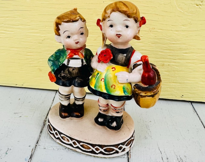 Vintage Occupied Japan ceramic figurine of a boy and girl in Bavarine attire, 50's figurine collectible