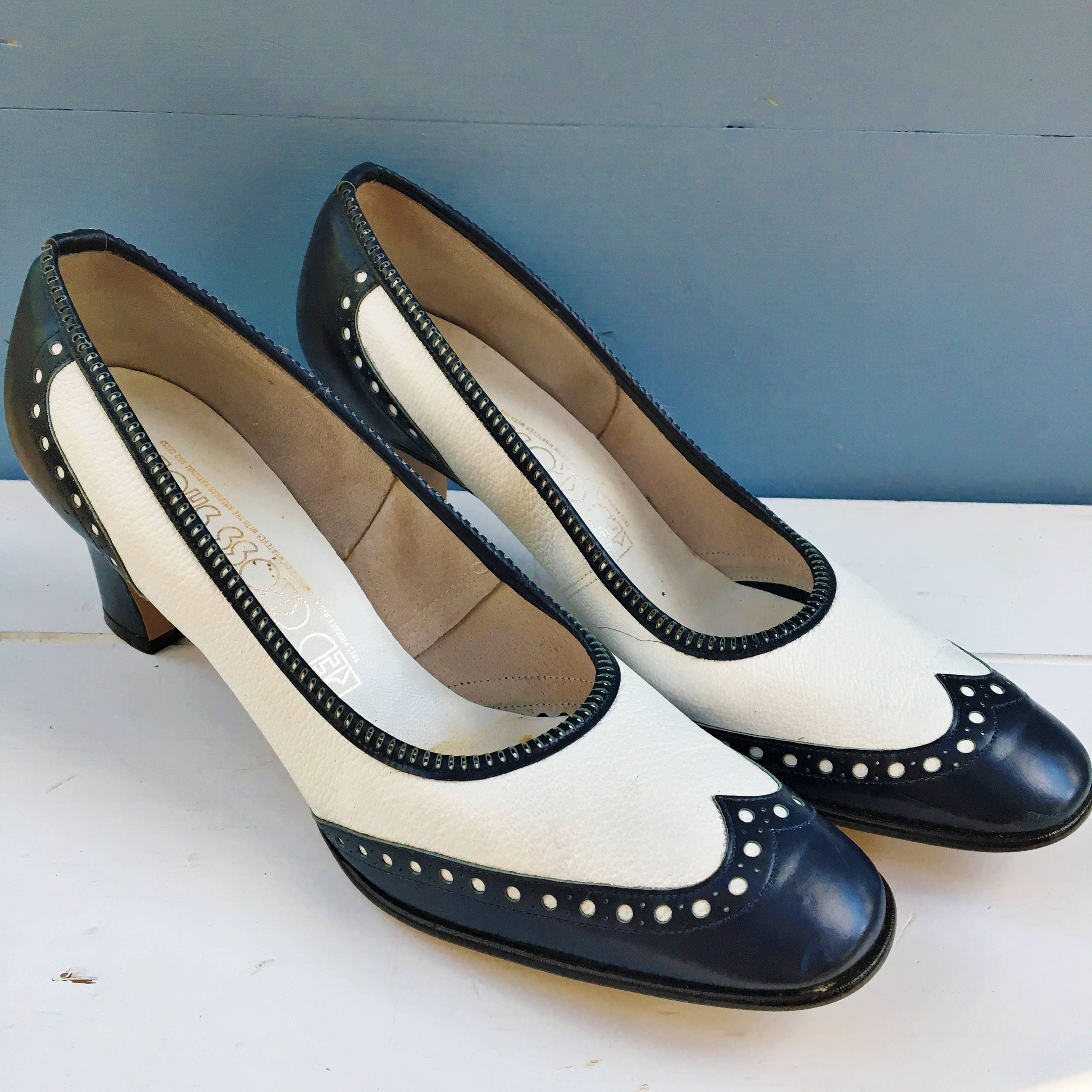 red and white spectator pumps