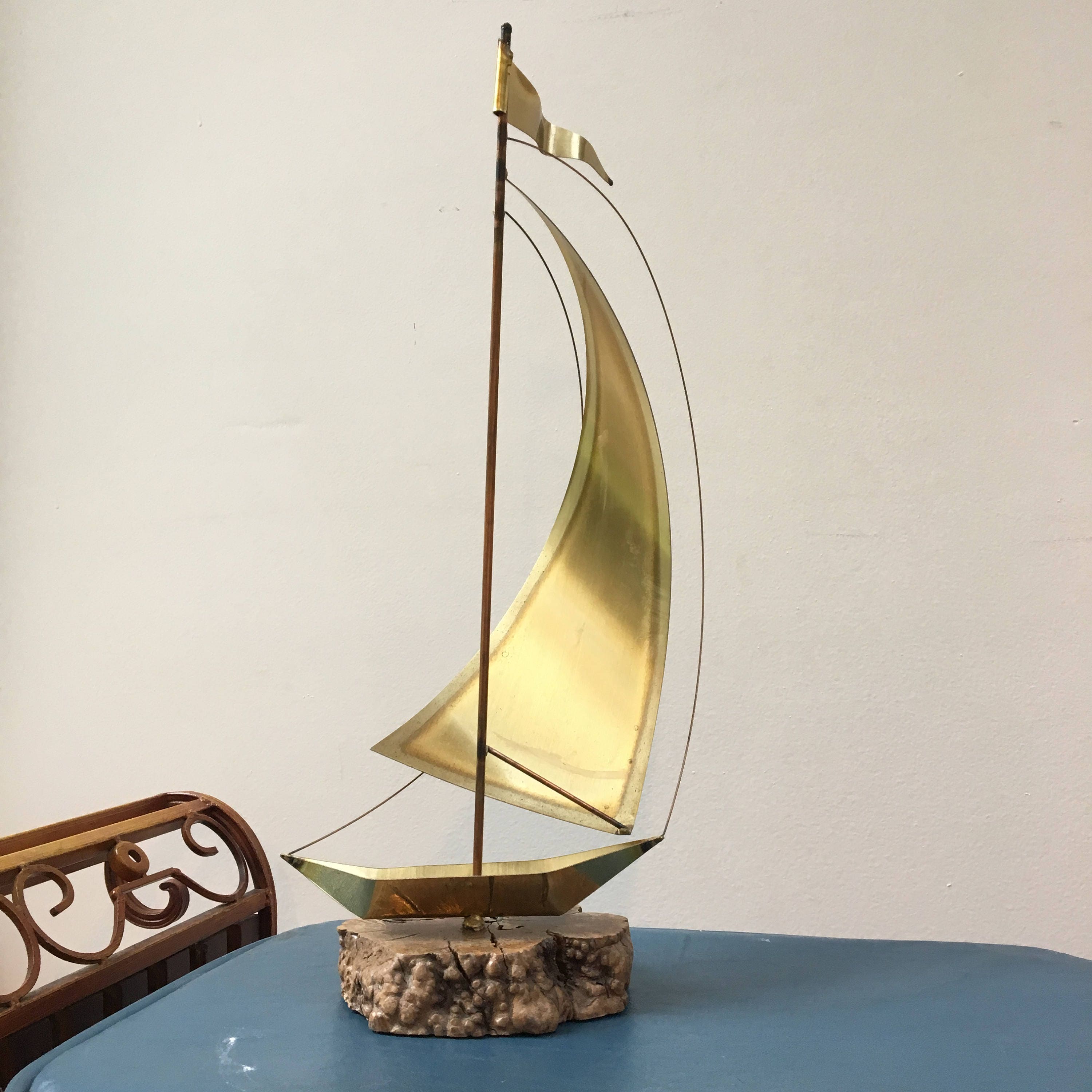 vintage brass sailboat