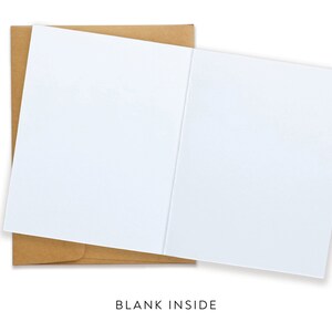 May include: A white blank greeting card with a brown envelope. The card is open, revealing a blank interior. The text "BLANK INSIDE" is printed at the bottom of the image. Perfect for personalized messages.