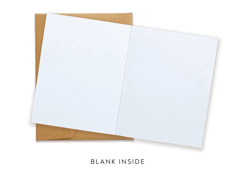 May include: A white blank greeting card with a brown envelope. The card is open, revealing a blank interior. The text "BLANK INSIDE" is printed at the bottom of the image. Perfect for personalized messages.