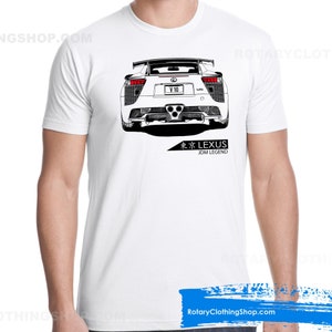 May include: White t-shirt with a black and white illustration of a Lexus LFA supercar. The car is shown from the rear and has the text "V10" on the license plate. The text "LEXUS" and "JDM LEGEND" are printed below the car.