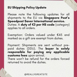May include: A white rectangular notice with a dark pink border and tape in the corners, featuring black text titled EU Shipping Policy Update. It details duties of 3 euros per HS code, exemptions for gifts under 45 euros, and buyer responsibility.