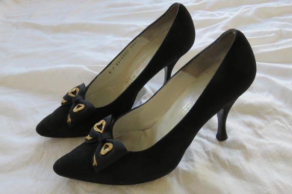 black heels with gold heel