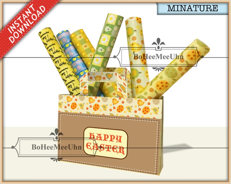 May include: A miniature paper bag with a brown front panel featuring the text HAPPY EASTER in red letters. The bag contains several rolls of patterned paper with yellow chicks, orange eggs, and green checkered designs. The bag has a top border with a chick and egg print.