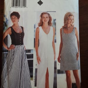 May include: A vintage sewing pattern for Eileen West clothing. The pattern features three different dress designs, including a black and white checkered skirt and dress, and a white dress. The pattern number is 4540.