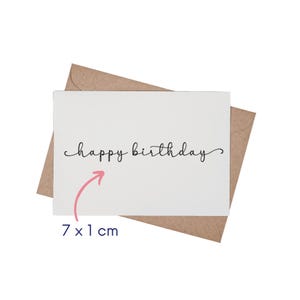 May include: A white card with the text "happy birthday" written in black cursive script. The card is 7 inches by 1 inch and is shown in a brown envelope.