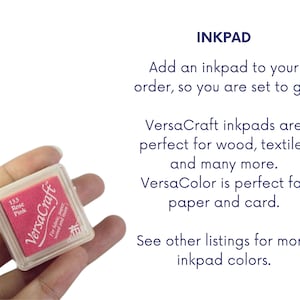 May include: A pink inkpad labeled "VersaCraft" for fabric, paper, wood, and more. The inkpad is labeled "133 Rose Pink".