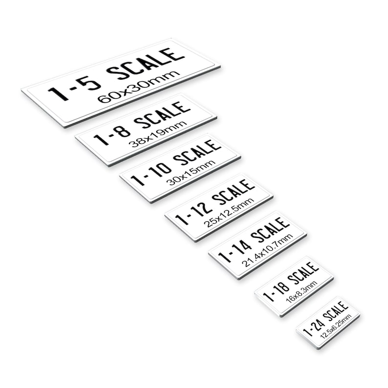 May include: A set of seven white rectangular signs with black text indicating different scales. The signs are arranged in a descending size order, with the largest sign at the top and the smallest sign at the bottom. The signs are labeled with the following scales: 1-5, 1-8, 1-10, 1-12, 1-14, 1-18, and 1-24. Each sign also includes the dimensions of the scale in millimeters.