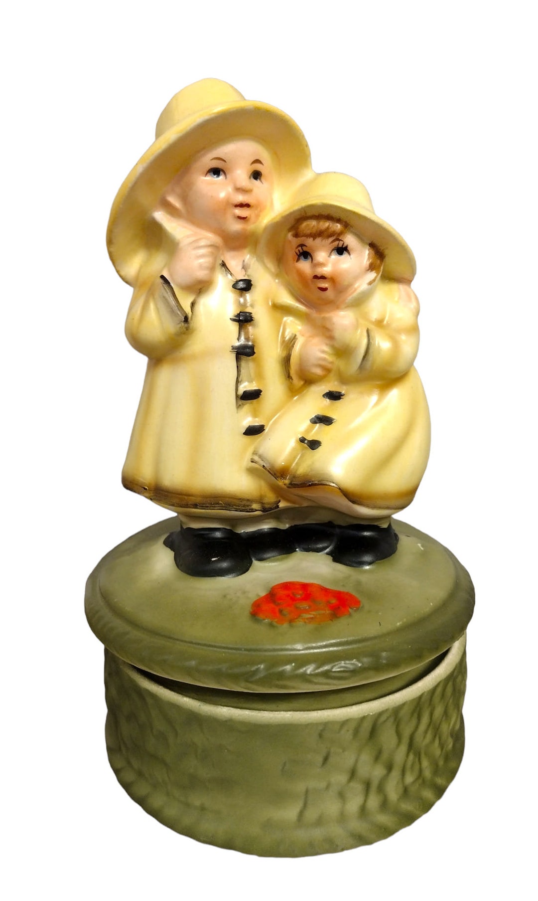 Vintage Revolving Musical Figurine Boy and Girl With Yellow Raincoats