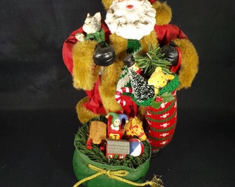 Christmas Decor Santa Claus with a Big Sack with Presents Holding Christmas Stocking