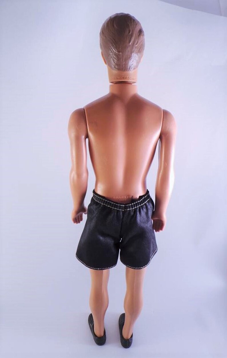 ken barbie doll in suit