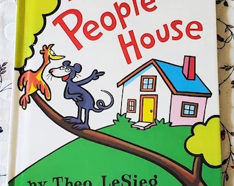 May include: A children's book cover with a yellow, orange, and black bird on a branch, a black and gray mouse, and a white house with a blue roof. The title of the book is "In a People House" by Theo. LeSieg, illustrated by Roy Mc Kie.
