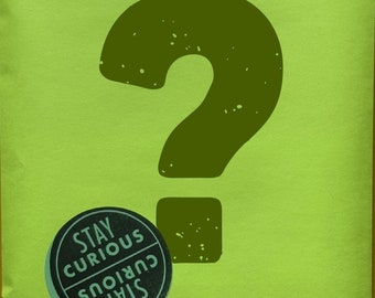 May include: A lime green package with a large dark green question mark. A circular sticker with the words "Stay Curious" is on the front. The Bailey Brown logo and website address are printed at the bottom.