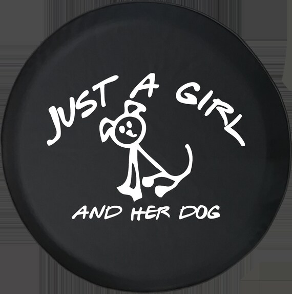 a girl her dog and her jeep tire cover