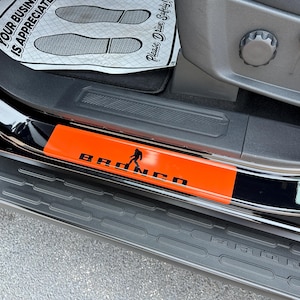 Set of BR0NC0 Vinyl Door Sill covering decals for 2021-2026.