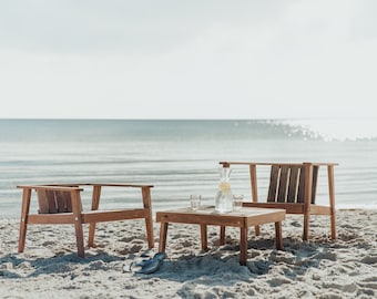 Lounge chair with small side table made of upcycled wood