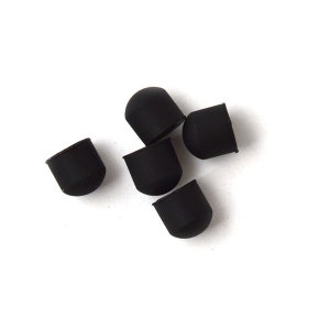 May include: Six black rubber furniture feet, also known as chair feet, are shown on a white background. These feet are designed to protect floors from scratches and wear.