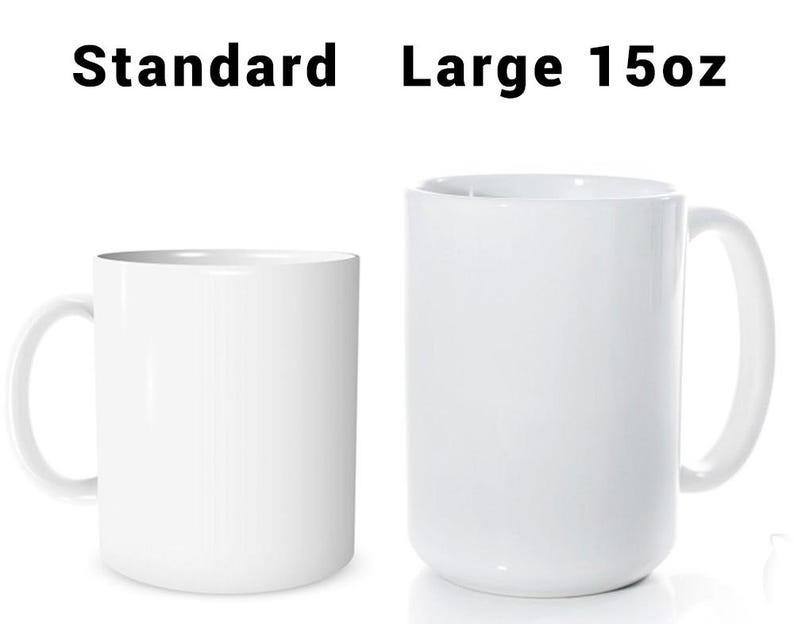 May include: Two white ceramic mugs, one standard size and one large 15oz. The mugs have a simple, clean design with a curved handle. The text "Standard" and "Large 15oz" is printed above the mugs.