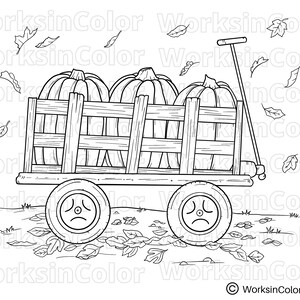Wagon filled with 3 large pumpkins. There are fall leaves falling to the ground.