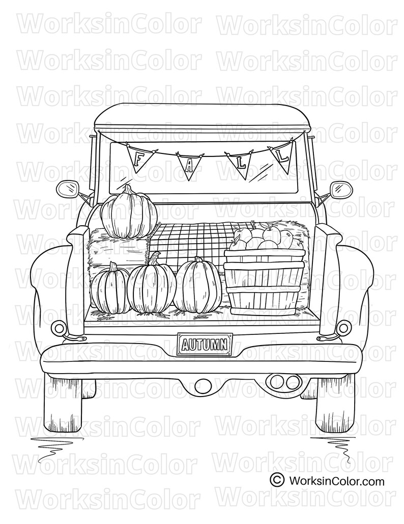 The back view of a pick up truck filled with pumpkins, hay bale and a basket of apples. The truck license plate says “autumn”.