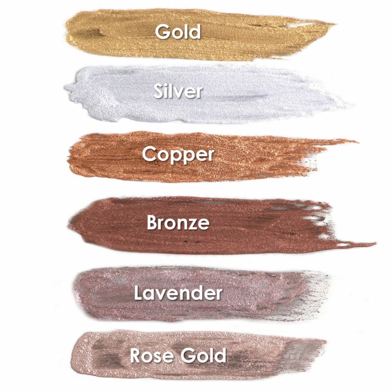 May include: Six metallic paint swatches in various colors, including gold, silver, copper, bronze, lavender, and rose gold. The swatches are arranged vertically on a white background.