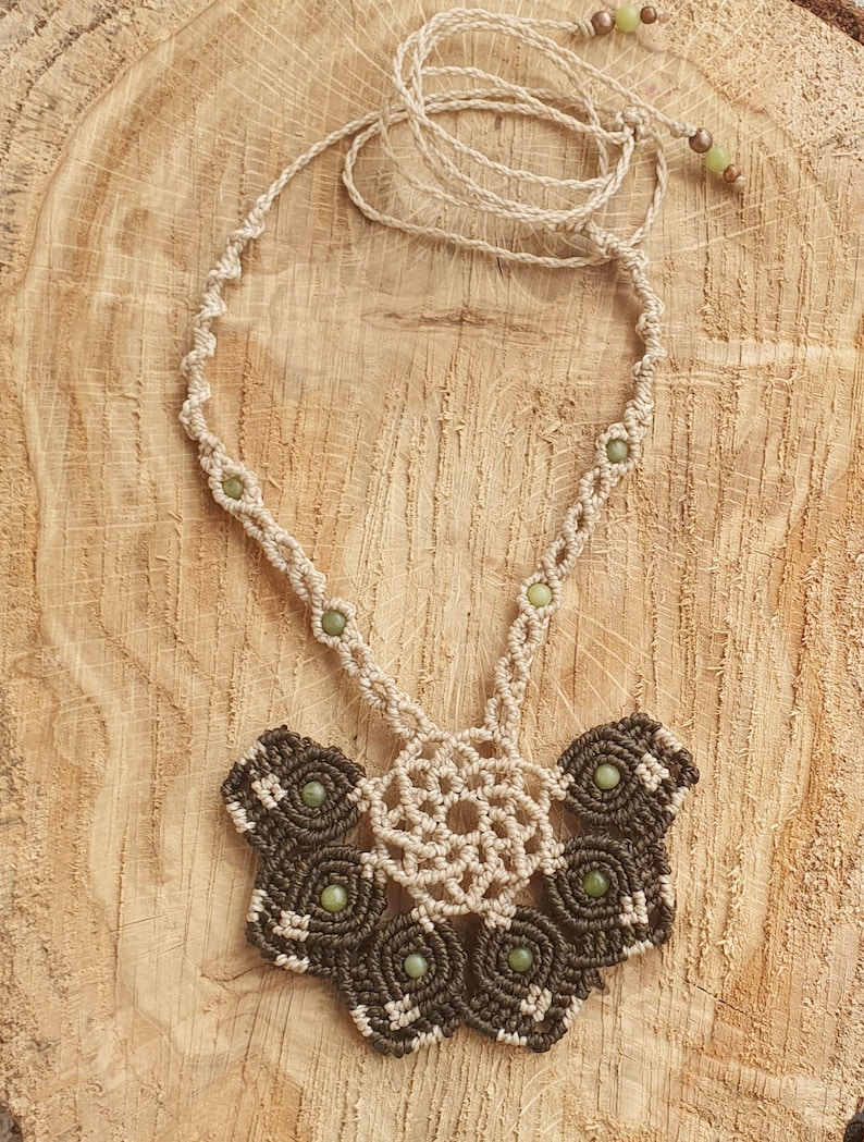 Macrame necklace in the shape of a floral half-mandala with jade beads