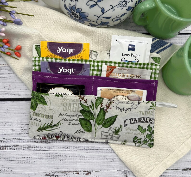 this tea wallet is also good for sweeteners, lens, cleaners, loyalty, card holder, credit card holder a little bit of cash and keeping your purse bag or carry-on organized