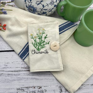 This little tea wallet is great to put in your purse or bag and keep things from going to the bottom of your purse or bag and makes things easy to find it also makes a great gift for a tea lover. You can put tea in it and give it away as a gift .