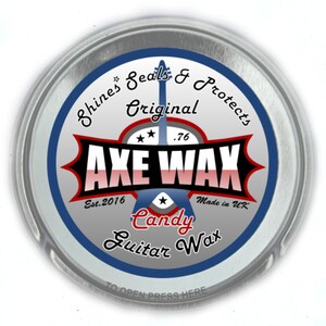 May include: A silver tin with a blue and red label that reads "Shines Seals & Protects Original .76 AXE WAX Est. 2016 * Made in UK Candy Guitar Wax".