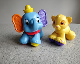 Set of 2 Collectibles Disney  Dumbo and Simba Baby Clicker Toys/ Set of 2  Fisher Price Disney Dumbo and Simba Plastic Toys