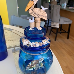Large Beautiful nautical pelican shell jar 11.5”x5” beach theme