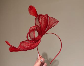 Pretty red fascinator on Aliceband