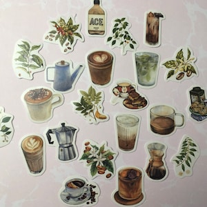May include: A collection of watercolor stickers featuring coffee-related illustrations. The stickers depict various coffee drinks, coffee beans, coffee plants, and coffee-making equipment. The stickers include a bottle with the text "ACE".