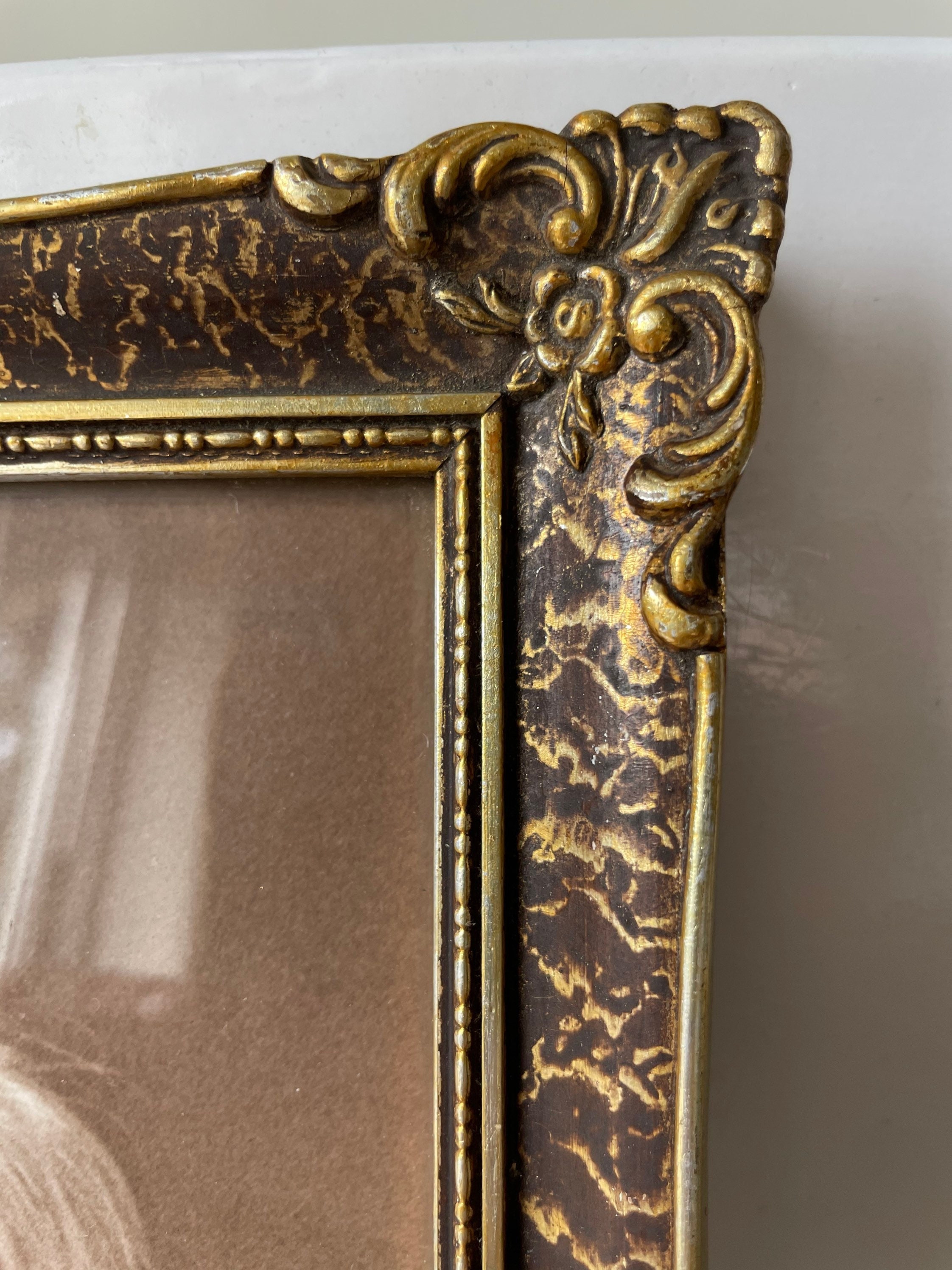 Vintage Wooden Frame With Gold Colored Details picture