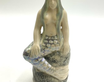 Deidad de bolsillo de sirena reservada