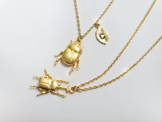 Gold bug necklace best sale