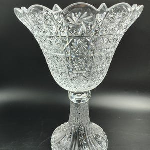 May include: A set of three ceramic mugs with a speckled, matte finish. The mugs are in shades of cream, light gray, and dark gray. Each mug has a simple, minimalist design and a rounded handle. Perfect for coffee or tea.