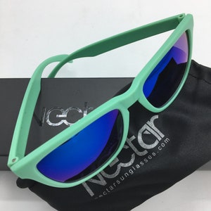 May include: Mint green sunglasses with blue mirrored lenses and a black microfiber pouch with the text "Nectar Sunglasses.com".