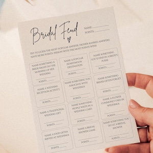 May include: A printable bridal shower game with a beige background and black text. The game is called "Bridal Feud" and asks players to guess the most popular answers to wedding-related questions.  The player with the most points wins.